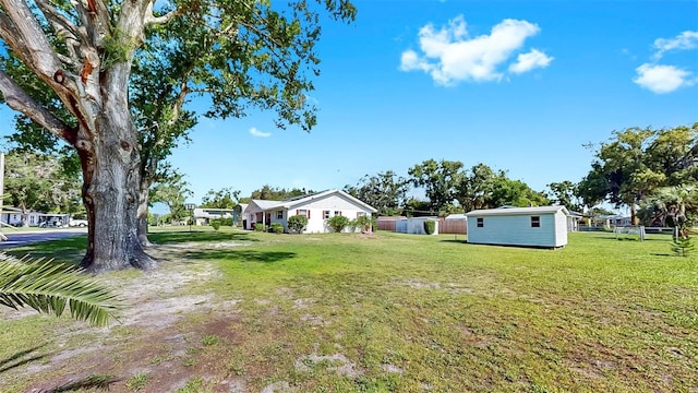 38919 3rd Ave, Zephyrhills, FL 33542 - view of yard featuring a storage unit