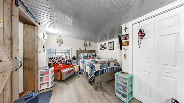 38919 3rd Ave, Zephyrhills, FL 33542 - bedroom with wood finished floors
