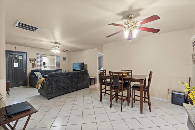 tiled dining room featuring ceiling fan