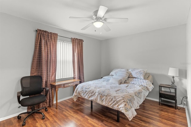 bedroom featuring ceiling fan and dark hardwood / wood-style flooring