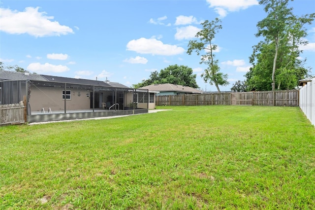 view of yard featuring glass enclosure