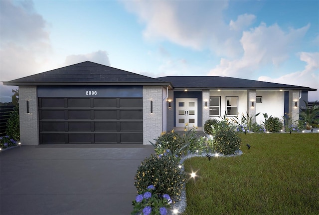 view of front of house with a garage and a front yard