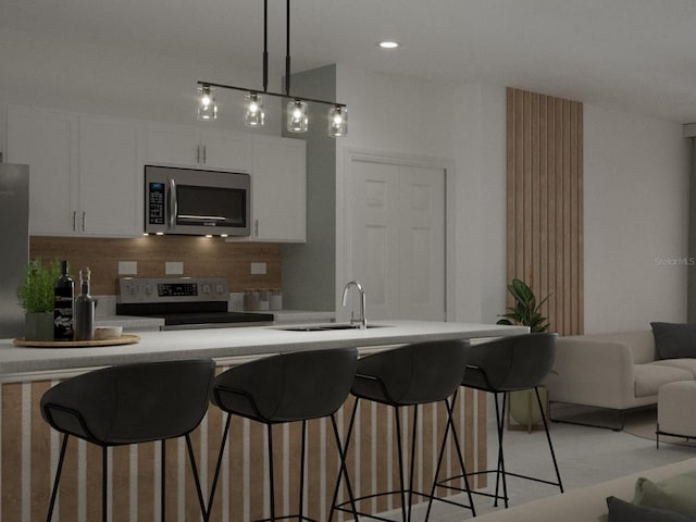 1520 Alameda, Spring Hill, FL 34609 - kitchen featuring stainless steel microwave, electric range oven, backsplash, white cabinets, and a kitchen breakfast bar