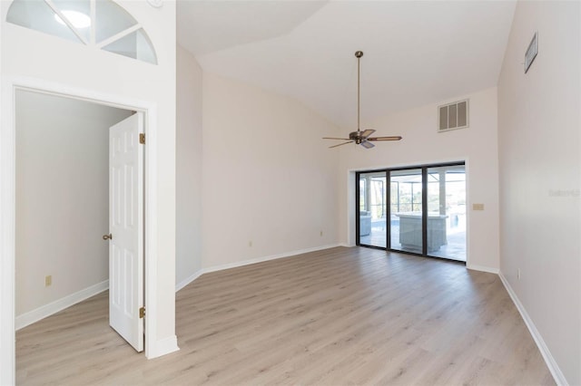 unfurnished room featuring light wood-type flooring, high vaulted ceiling, and ceiling fan