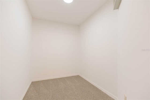 spare room with lofted ceiling and carpet floors