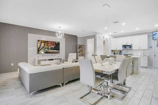 dining space featuring ornamental molding