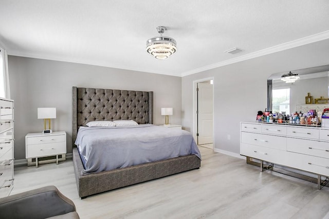 bedroom with light hardwood / wood-style flooring and crown molding