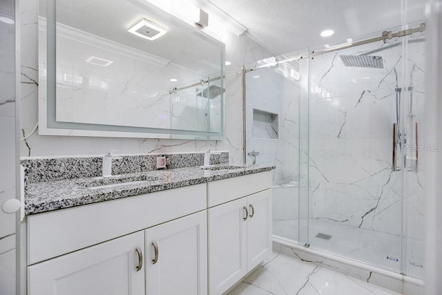 bathroom featuring vanity, an enclosed shower, and ornamental molding