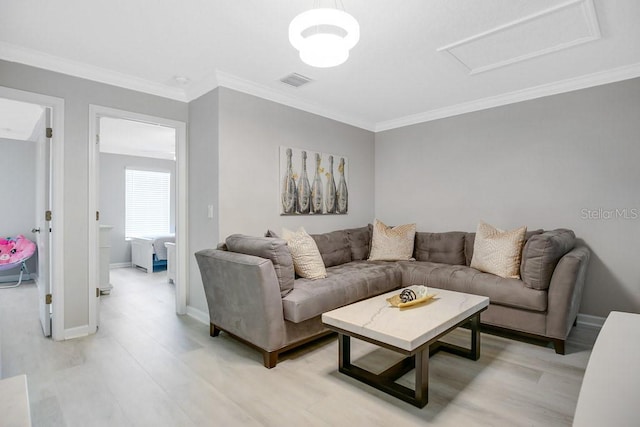 living room with light wood-type flooring and crown molding