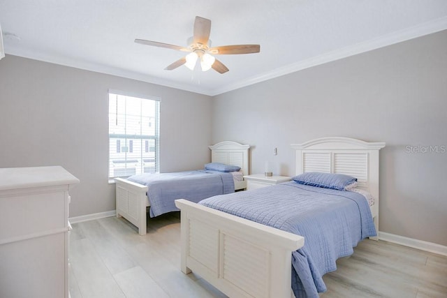 bedroom featuring ceiling fan, light hardwood / wood-style floors, and ornamental molding