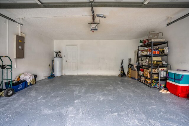 garage with a garage door opener, gas water heater, and electric panel