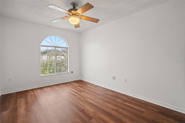 empty room with hardwood / wood-style floors, a textured ceiling, and ceiling fan