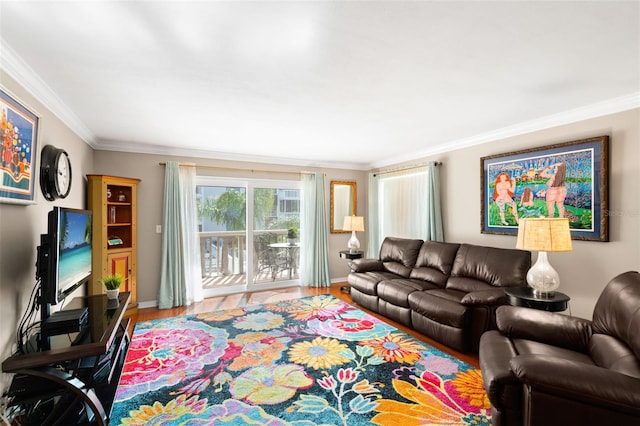 living room with hardwood / wood-style floors and ornamental molding