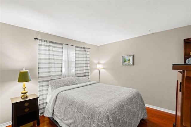 bedroom with wood-type flooring