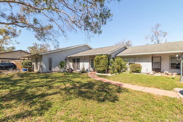 single story home featuring a front yard