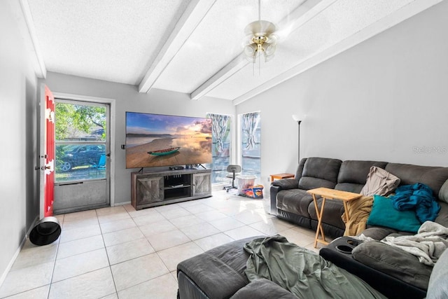 tiled living room featuring ceiling fan, a textured ceiling, and lofted ceiling with beams