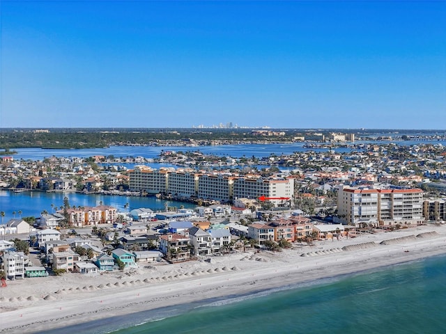 drone / aerial view with a water view and a view of the beach