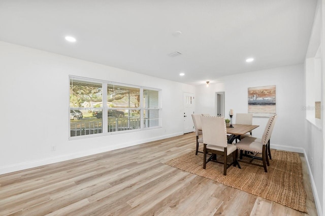 dining space with light wood-type flooring