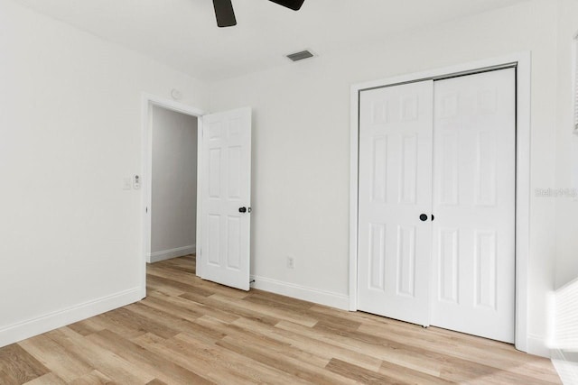 unfurnished bedroom with a closet, ceiling fan, and light wood-type flooring