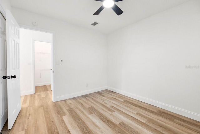 unfurnished room featuring ceiling fan and light hardwood / wood-style flooring