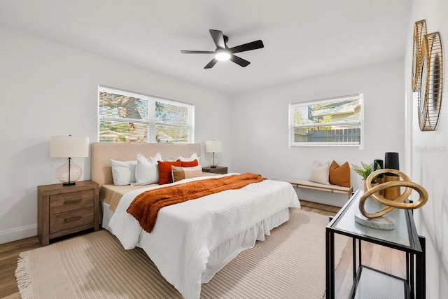 bedroom featuring wood-type flooring and ceiling fan