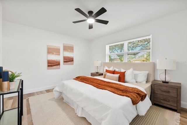 bedroom with light wood-type flooring and ceiling fan