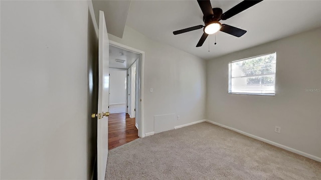 carpeted empty room with ceiling fan