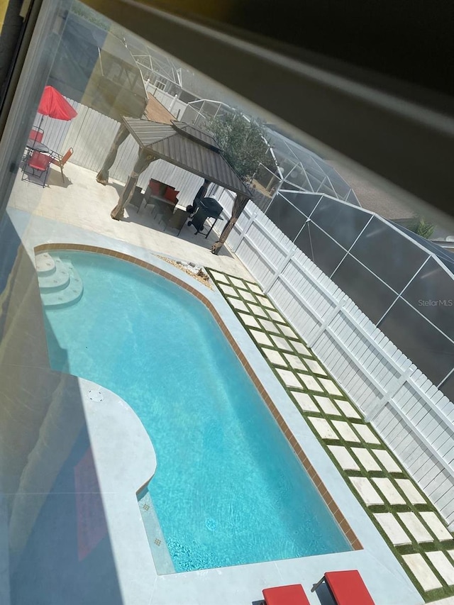 view of pool featuring a gazebo and a patio area