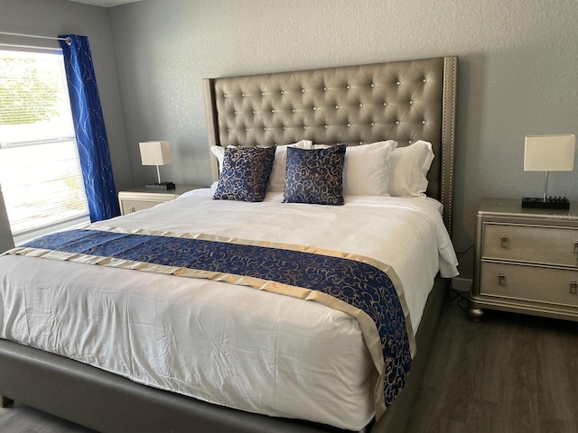 bedroom featuring dark hardwood / wood-style flooring