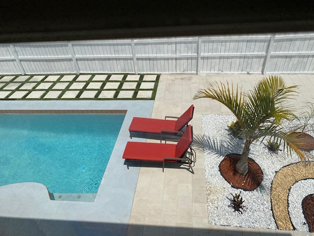 view of swimming pool with a patio area