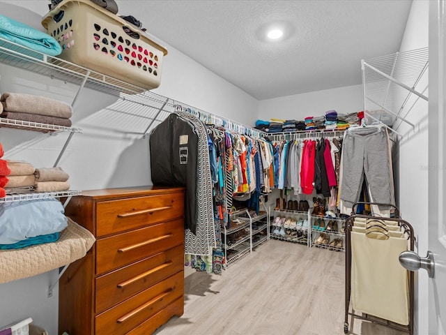 spacious closet featuring light wood-type flooring