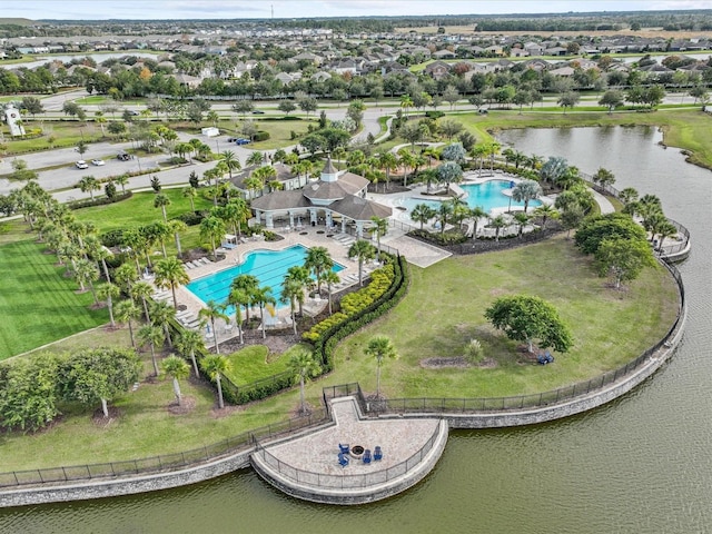 birds eye view of property with a water view