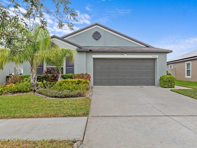 ranch-style home with a garage