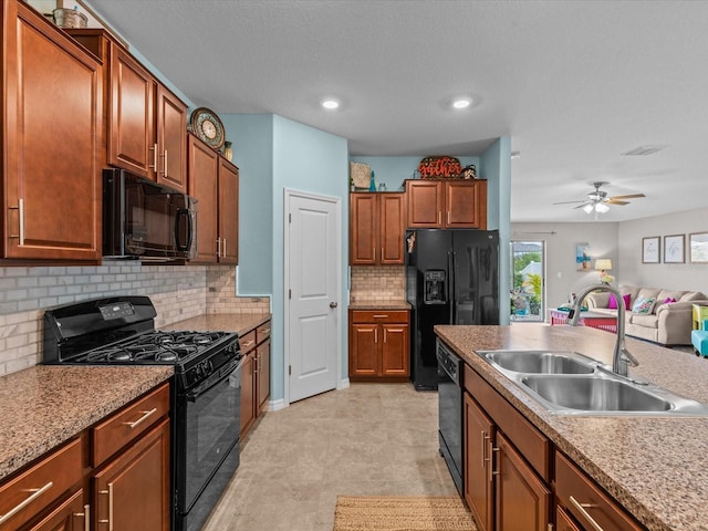 kitchen with decorative backsplash, a textured ceiling, ceiling fan, sink, and black appliances