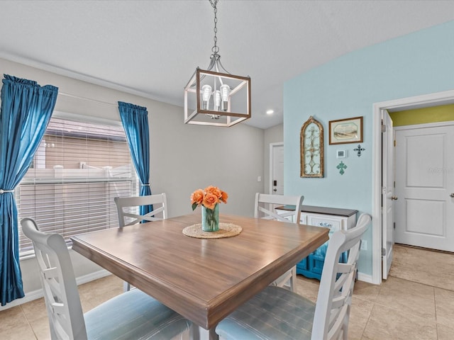 tiled dining area with a notable chandelier