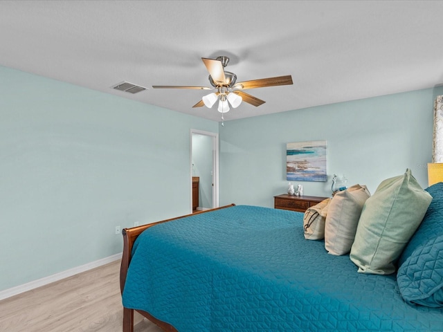 bedroom with ceiling fan and light wood-type flooring