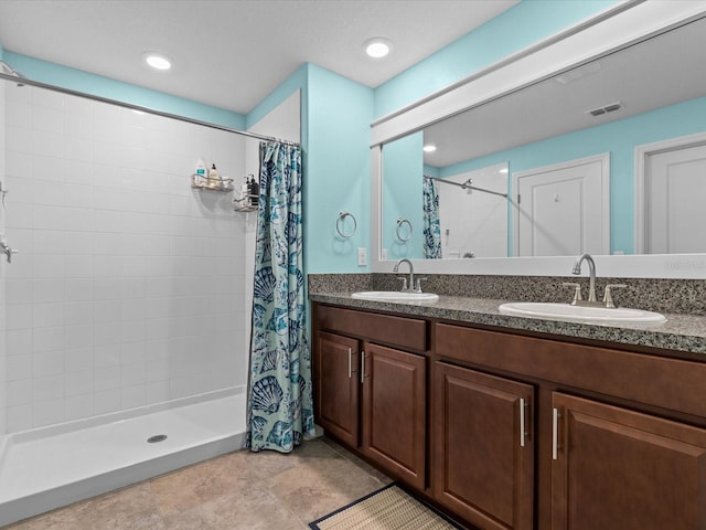 bathroom featuring a shower with curtain and vanity