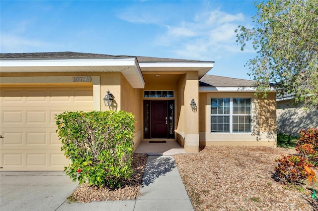 doorway to property featuring a garage