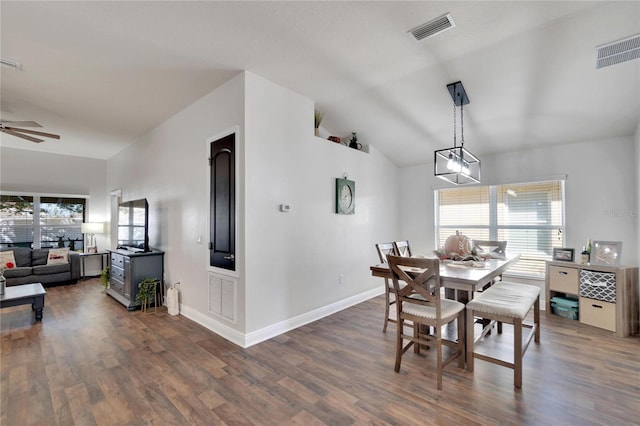 dining room featuring dark hardwood / wood-style floors, ceiling fan, and lofted ceiling