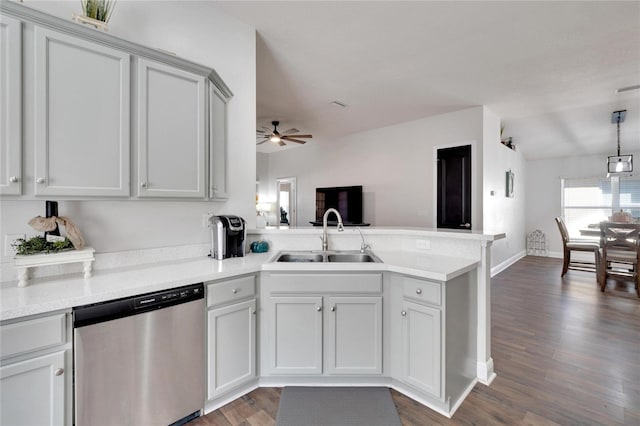 kitchen with ceiling fan, dishwasher, sink, dark hardwood / wood-style floors, and kitchen peninsula