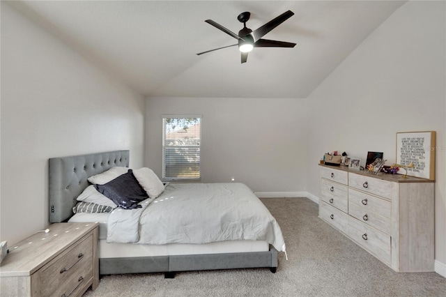 carpeted bedroom with vaulted ceiling and ceiling fan