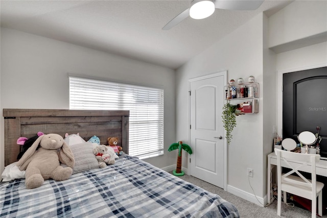 bedroom with multiple windows, carpet, vaulted ceiling, and ceiling fan