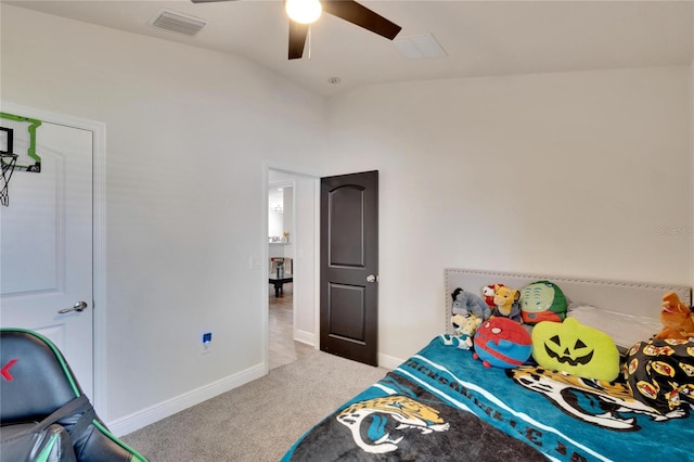 carpeted bedroom featuring ceiling fan and vaulted ceiling