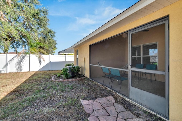 view of yard featuring a sunroom