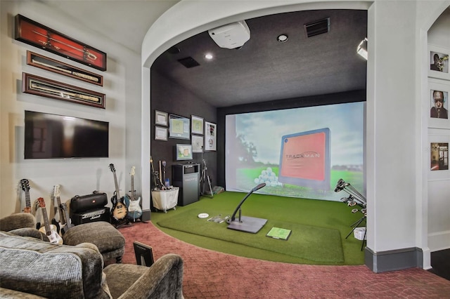 playroom with carpet and golf simulator