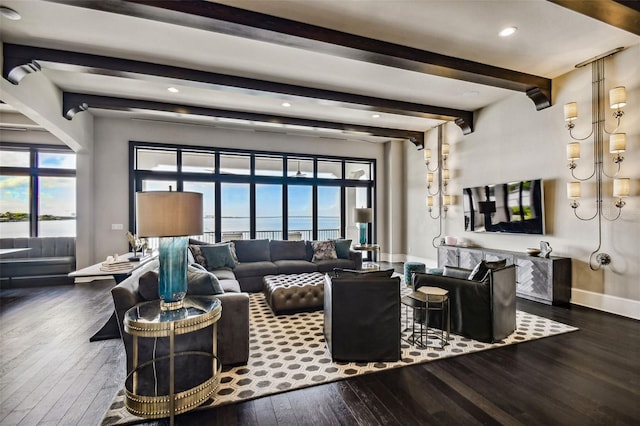 living room with beam ceiling, dark hardwood / wood-style floors, and a healthy amount of sunlight