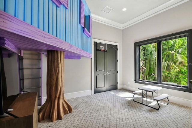 interior space featuring carpet floors and crown molding