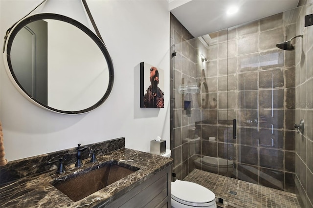 bathroom with vanity, toilet, and walk in shower