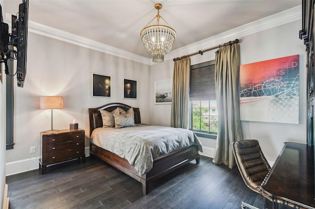 bedroom featuring dark hardwood / wood-style floors, ornamental molding, and a chandelier