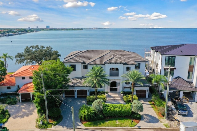 birds eye view of property with a water view